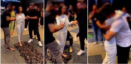 Mulher anda sobre cacos de vidro durante dinâmica de evento com empresários em hotel de luxo